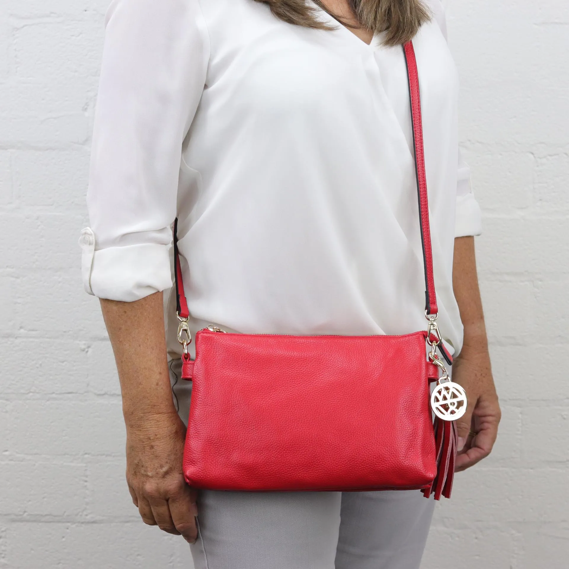 Ruby leather or suede clutch crossbody bag